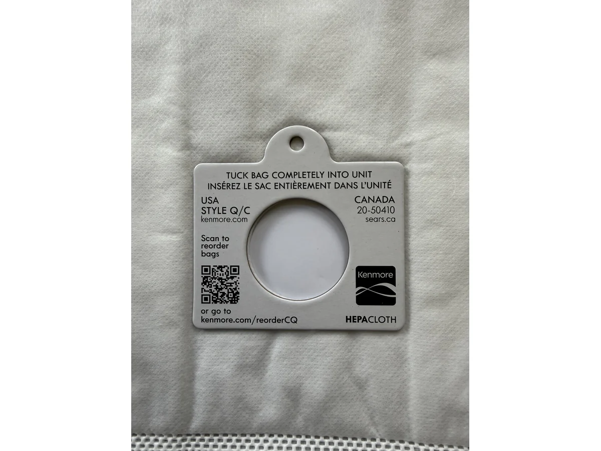 Kenmore Type Q/C canister vacuum bag plastic collar close up with Style Q/C label