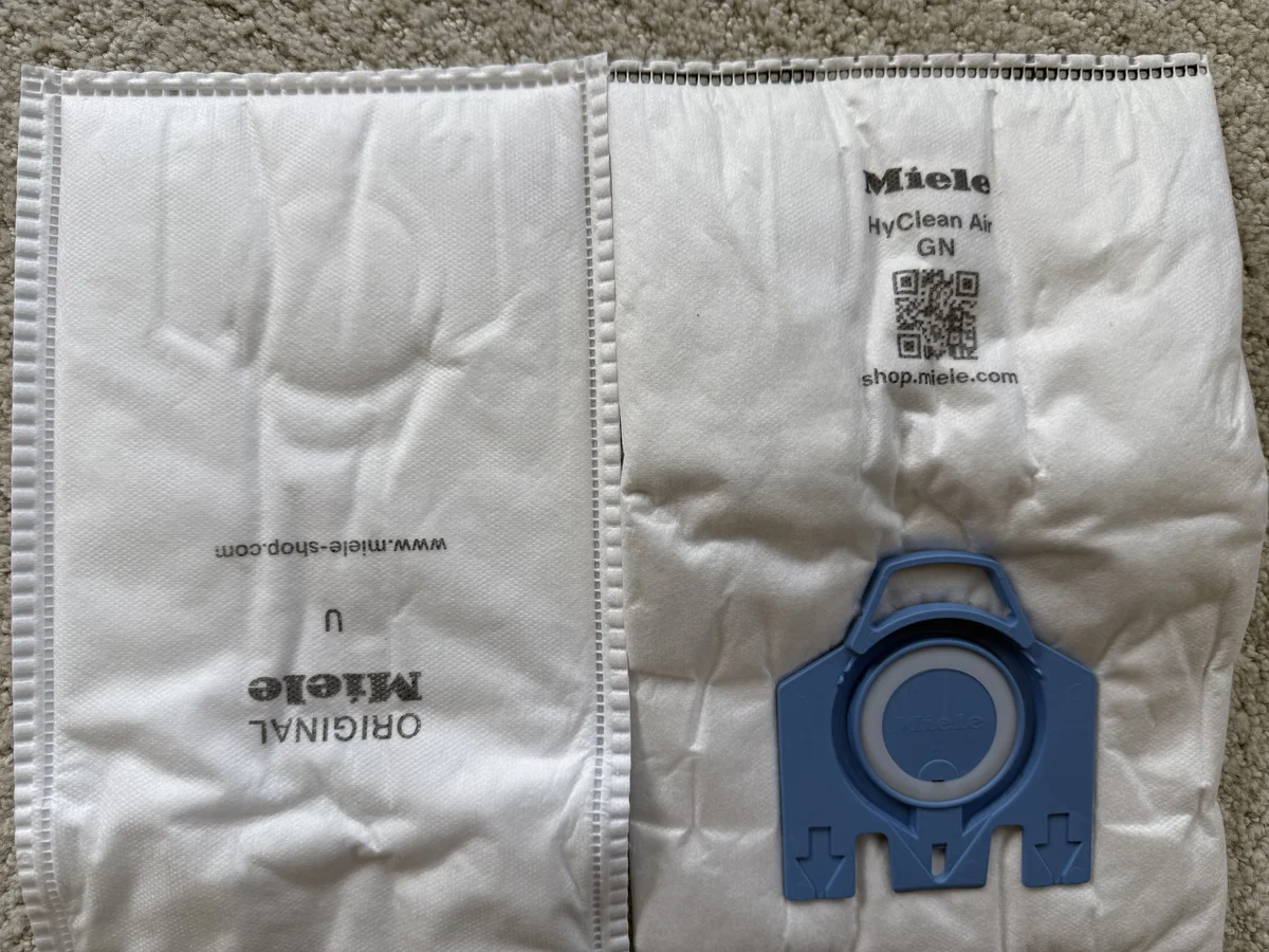 Miele GN vacuum bag blue collar and sealing ring photographed flat