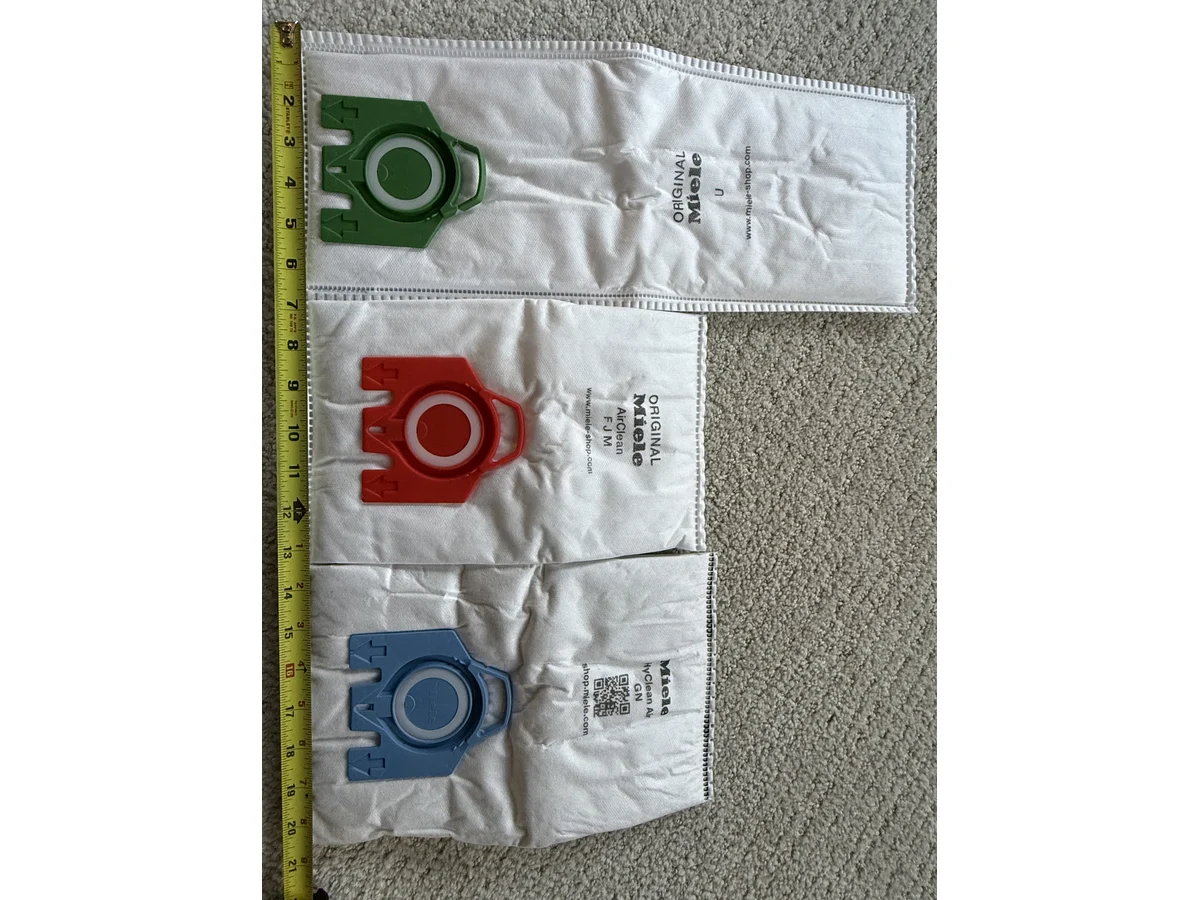 Miele Type U FJM and GN vacuum bags measured side by side by length