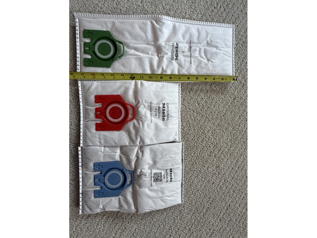 Miele Type U FJM and GN vacuum bags measured side by side by width