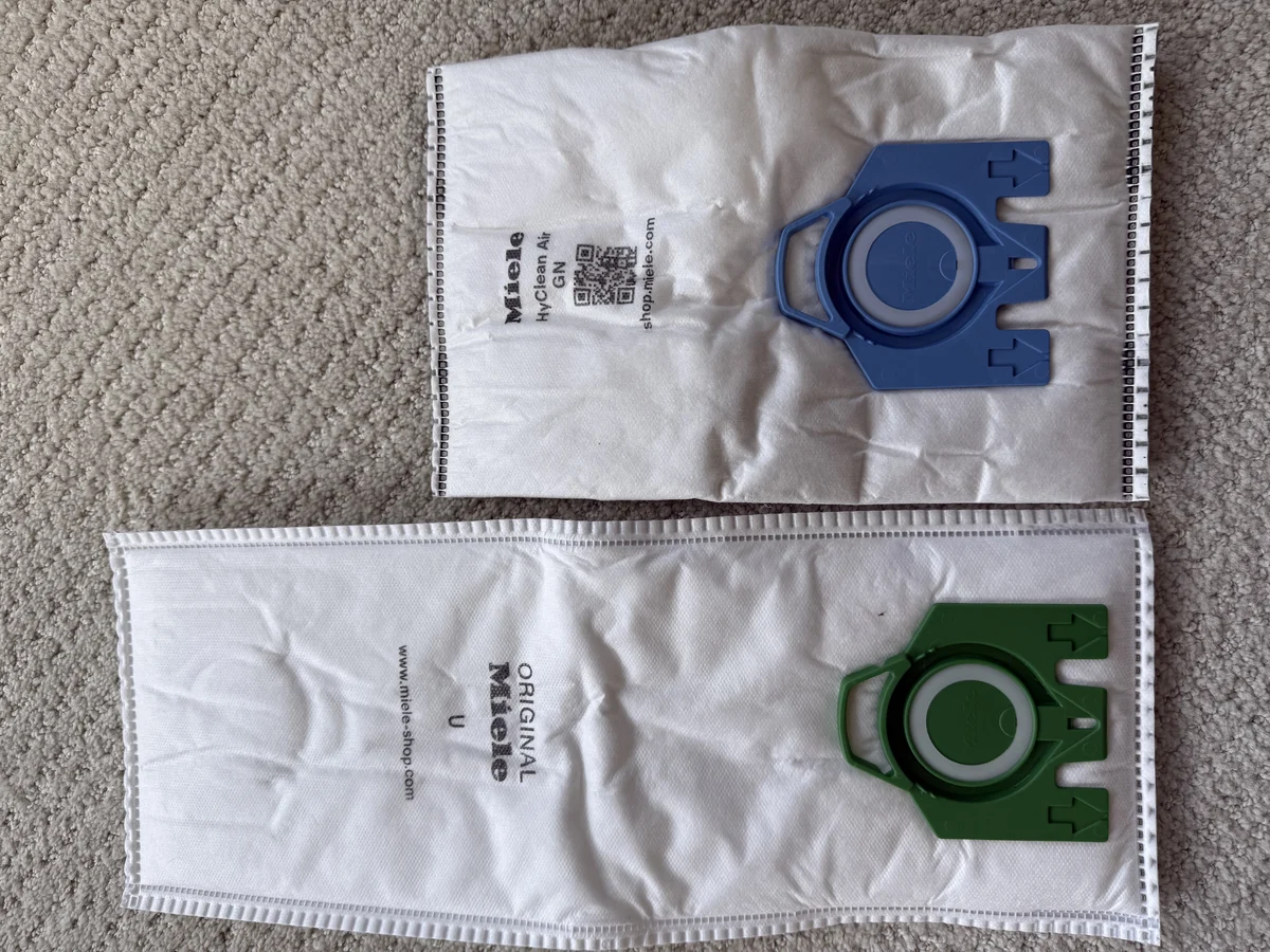 Miele Type U green collar bag beside Miele GN blue collar bag
