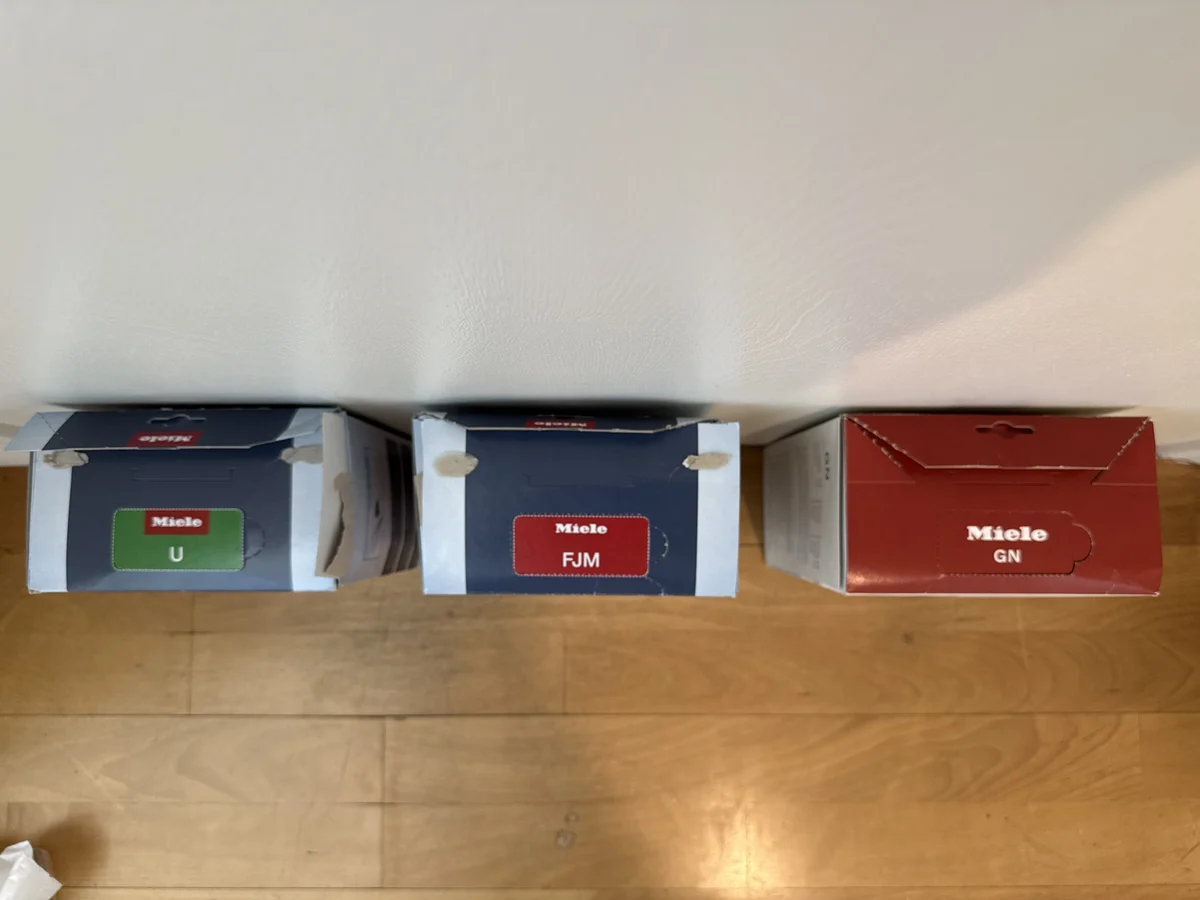 Miele Type U FJM and GN box top labels compared by bag code