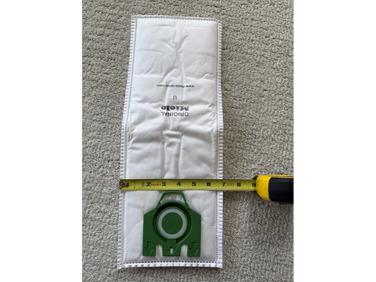 Miele Type U vacuum bag green collar and sealing ring photographed flat
